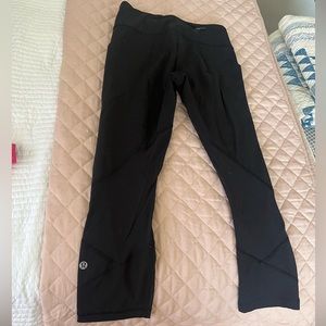 Lululemon black cropped leggings with mesh panel. Size 4.